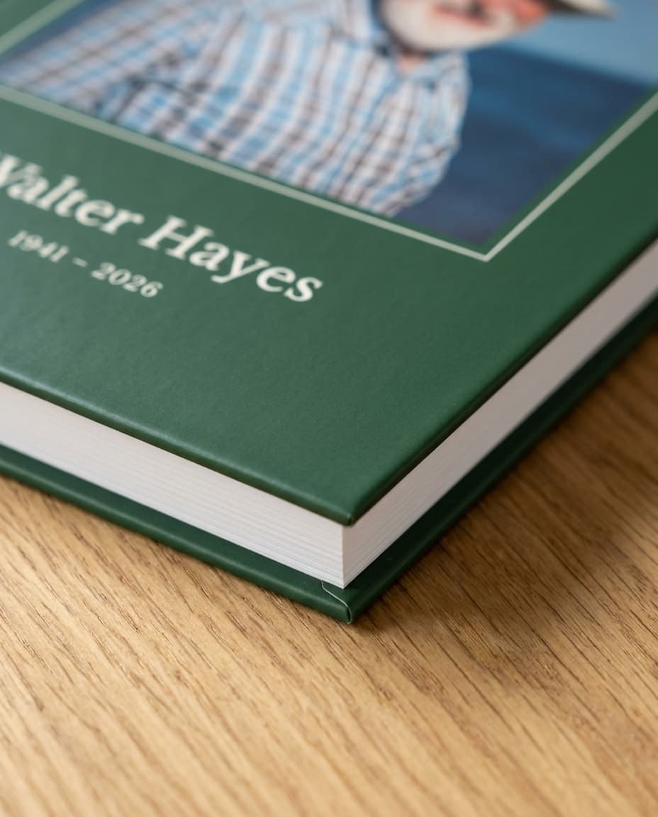A close view of the cover's corner: the matte finish, the rule around the photo, and the page block